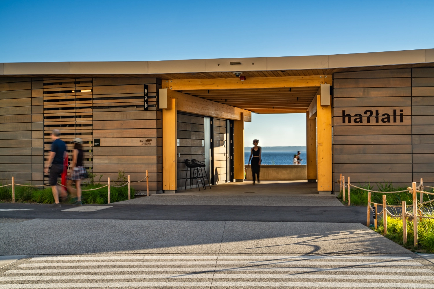The side of the amenities building with the name carved out of the wood siding.
