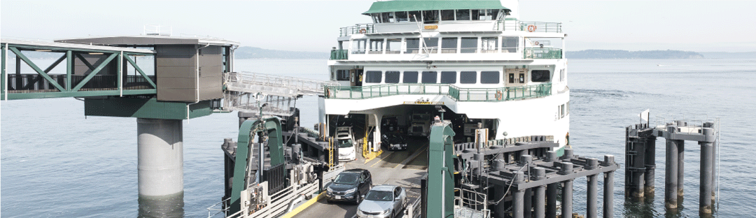 Cars disembarking from a Washington State Ferry at a station