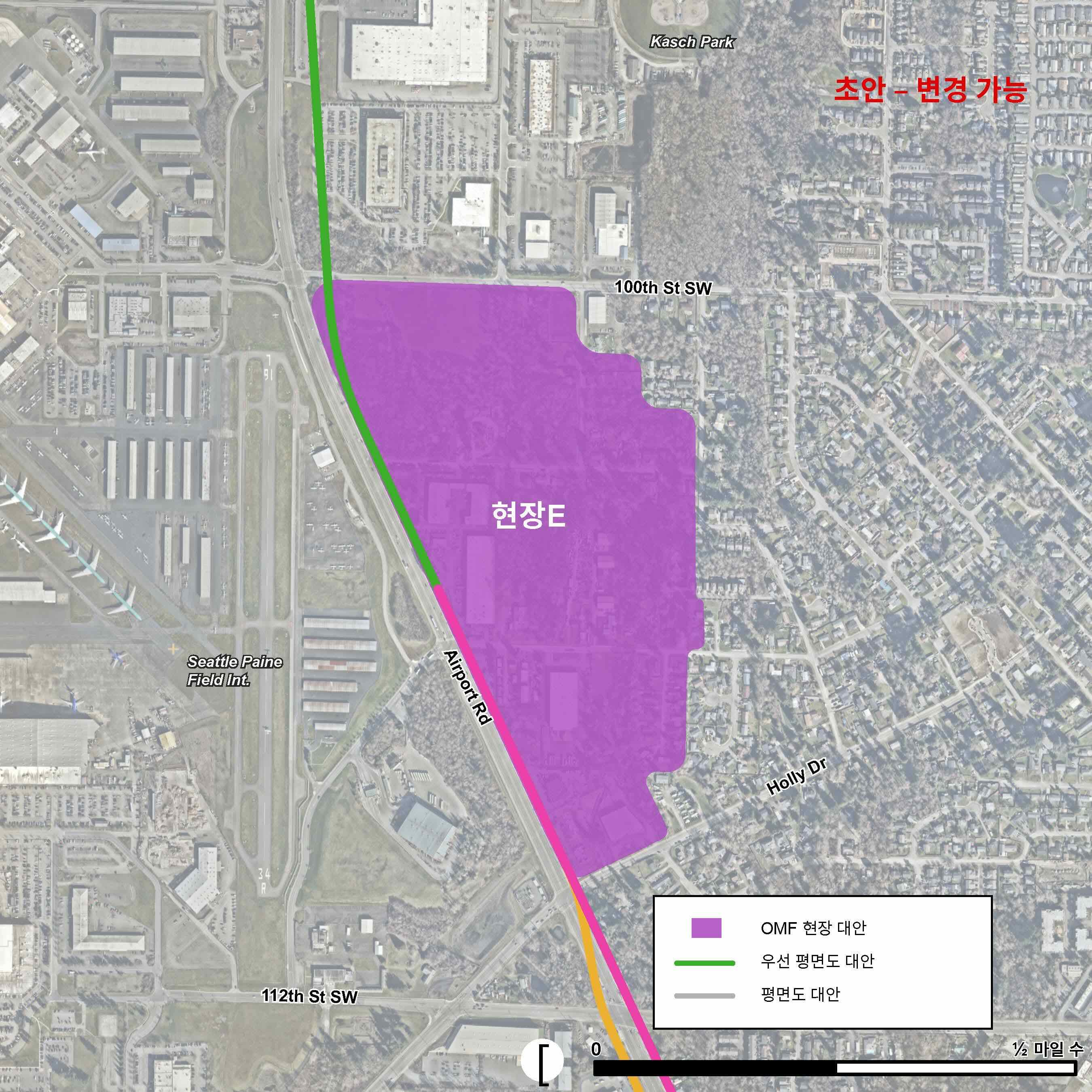 OMF Site E의 위치는 보라색으로 표시됩니다. OMF Site E의 경계는 서쪽으로 Airport Road, 북쪽으로 100th Street Southwest 입니다.