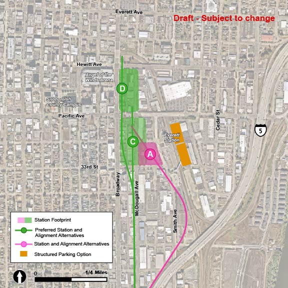  The proposed parking structures for Everett Station are shown in rectangular beige blocks that are located adjacent to the existing Everett Amtrak Station, in the area just west of Amtrak. The EVT-A and EVT-1 alternatives are both shown in pink. The EVT-1 elevated route runs north along the existing Amtrak train tracks, before ending near the existing Everett Amtrak Station. The EVT-2 and EVT-3 route alternatives, as well as the EVT-C and EVT-D station alternatives, are all shown in green, with green indicating that they are the preferred alternative. The elevated EVT-2 route runs north into downtown along the westside of McDougall Avenue before ending just north of Pacific Avenue. The EVT-3 route alternative follows the EVT-2 route’s path into downtown Everett, but veers left onto Broadway, where the route continues along the eastside of Broadway before ending north of Hewitt Avenue. The EVT-C station alternative is shown in a green circle along the EVT-2 route alternative and is located at the intersection of McDougall Avenue and 32nd Street. The EVT-D station alternative is shown in a green circle along the EVT-3 route, located at the intersection of Broadway and Wall Street.