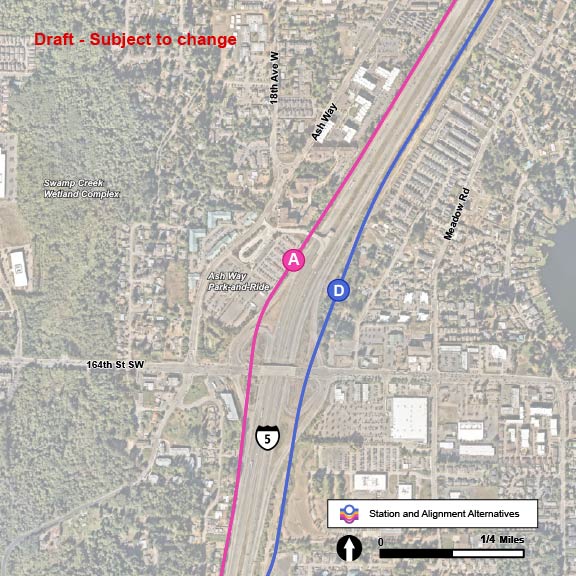 Along the ASH-1 and ASH-2 route alternatives, there are two potential station alternatives indicated: ASH-A and ASH-D. The ASH-A station alternative is located along the ASH-1 route alternative, which follows Interstate 5 north with tracks west of the interstate. The station is located at the Ash Way Park-and Ride. The ASH-D station alternative is located along the ASH-2 route alternative, which follows Interstate 5 north with tracks east of the interstate. The station is located central to the Ash Way Park and Ride on the east side of Interstate 5.